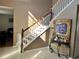 Bright entryway with staircase, console table, and view into living room at 4517 Se 28Th St, Ocala, FL 34480