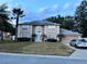 Two-story house with solar panels and a landscaped lawn at 4517 Se 28Th St, Ocala, FL 34480