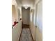 Hallway with wood floors and neutral walls, featuring arched alcoves at 4517 Se 28Th St, Ocala, FL 34480