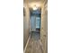 Hallway with light grey walls and wood-look flooring at 4517 Se 28Th St, Ocala, FL 34480