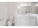 Bathroom with white vanity, gray tile shower, and a quartz countertop at 5 Pine Course Loop, Ocala, FL 34472