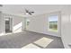 Spacious bedroom with gray carpeting and large windows at 5 Pine Course Loop, Ocala, FL 34472