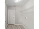 Laundry room with wire shelving, vinyl flooring and an exterior door at 5 Pine Course Loop, Ocala, FL 34472