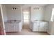 Double vanity bathroom with white cabinets and granite countertops at 5322 Sw 137Th Ct, Ocala, FL 34481