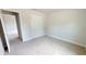 Spacious bedroom with neutral carpeting and double doors at 5322 Sw 137Th Ct, Ocala, FL 34481