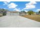 Single-story home with a large driveway at 5894 Sw 102Nd Ln, Ocala, FL 34476