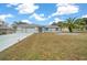 Single-story home with a wide driveway and palm tree at 5894 Sw 102Nd Ln, Ocala, FL 34476