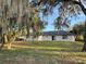 Large backyard with mature trees and open space at 5921 Se 4Th Pl, Ocala, FL 34472