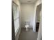 Simple bathroom with toilet and window at 5921 Se 4Th Pl, Ocala, FL 34472