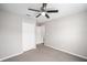 Spacious bedroom with ceiling fan and double door closet at 6574 Se 108Th Ln, Belleview, FL 34420