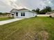 Newly built home with driveway and grassy yard at 6574 Se 108Th Ln, Belleview, FL 34420