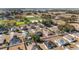 Wide aerial view of a neighborhood with houses and equestrian facilities at 6695 Sw 64Th Ter, Ocala, FL 34476