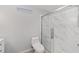 Updated bathroom with marble shower and modern toilet at 6695 Sw 64Th Ter, Ocala, FL 34476