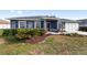 House exterior showcasing gray siding and landscaping at 6695 Sw 64Th Ter, Ocala, FL 34476