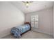 Spacious bedroom with carpeted floor and window with shutters at 6836 Sw 179Th Court Rd, Dunnellon, FL 34432