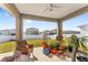 Relaxing covered patio with wicker furniture and potted plants at 7094 Sw 60Th Ln, Ocala, FL 34474