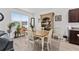 Bright dining room featuring a wooden table, chairs, and built-in hutch at 7094 Sw 60Th Ln, Ocala, FL 34474