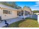 Home exterior showcasing a screened porch and fenced yard at 8681 Sw 93Rd Pl # B, Ocala, FL 34481