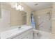 Bathroom with shower/tub combo, white vanity, and tiled floors at 8681 Sw 93Rd Pl # B, Ocala, FL 34481