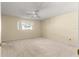 Spacious bedroom with neutral carpeting and ceiling fan at 8681 Sw 93Rd Pl # B, Ocala, FL 34481