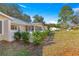 Landscaped yard with a white picket fence and homes at 8681 Sw 93Rd Pl # B, Ocala, FL 34481