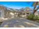 Front view of a single-story home with a carport and landscaped yard at 8681 Sw 93Rd Pl # B, Ocala, FL 34481