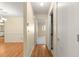 Clean hallway with wood-look floors connecting to bedrooms and bathroom at 8681 Sw 93Rd Pl # B, Ocala, FL 34481