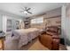 Charming bedroom with relaxing decor and a comfortable armchair at 900 Mulberry St, Fruitland Park, FL 34731