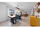 Dining area with a rustic table and chairs, open to the living room at 900 Mulberry St, Fruitland Park, FL 34731