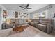 Living room with sectional sofa and decorative wall at 900 Mulberry St, Fruitland Park, FL 34731