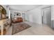 Living room with hardwood floors and a leather couch at 900 Mulberry St, Fruitland Park, FL 34731