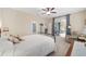 Main bedroom with access to private patio, ceiling fan, and carpeted floor at 1065 Ne 31St Ter, Ocala, FL 34470