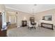 Elegant dining room with a chandelier, comfortable seating, and an open view of the home's entryway at 1065 Ne 31St Ter, Ocala, FL 34470