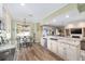 Bright kitchen features stainless steel appliances and breakfast nook with outside view at 1065 Ne 31St Ter, Ocala, FL 34470