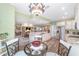 Open-concept kitchen with granite countertops, stainless steel appliances and connected living space at 1065 Ne 31St Ter, Ocala, FL 34470