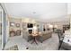 Bright and airy living room with a fireplace, built-in shelving, and seamless flow into the dining area at 1065 Ne 31St Ter, Ocala, FL 34470