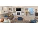 Spacious living room with fireplace, built-in shelves, and comfortable seating arrangement at 1065 Ne 31St Ter, Ocala, FL 34470