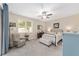 Comfortable main bedroom with ceiling fan, neutral colors, and natural lighting at 1065 Ne 31St Ter, Ocala, FL 34470