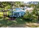 House with screened porch and landscaping, near golf course at 10801 Sw 71St Ave, Ocala, FL 34476