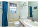 Bathroom with tub, toilet and sink at 10801 Sw 71St Ave, Ocala, FL 34476