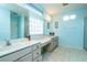 Large bathroom with dual vanities and a walk-in shower at 10801 Sw 71St Ave, Ocala, FL 34476