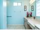 Bathroom with dual sinks and light blue walls at 10801 Sw 71St Ave, Ocala, FL 34476