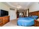 Main bedroom with king-size bed and private access at 10801 Sw 71St Ave, Ocala, FL 34476