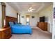 Main bedroom with king-size bed and built-ins at 10801 Sw 71St Ave, Ocala, FL 34476