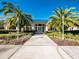 Community clubhouse with palm trees and landscaped grounds at 10801 Sw 71St Ave, Ocala, FL 34476