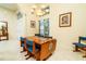 Dining area with a wood table, blue chairs, and a chandelier at 10801 Sw 71St Ave, Ocala, FL 34476