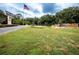 Impressive entrance to Oak Run, featuring a flag and water feature at 10801 Sw 71St Ave, Ocala, FL 34476