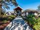 Elegant clubhouse entrance with stone accents and landscaping at 10801 Sw 71St Ave, Ocala, FL 34476