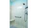 Clean shower with a built-in seat and grab bar at 10801 Sw 71St Ave, Ocala, FL 34476