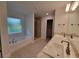 Elegant bathroom featuring double sinks, a shower, and a bathtub at 13392 Sw 33Rd Ct, Ocala, FL 34473